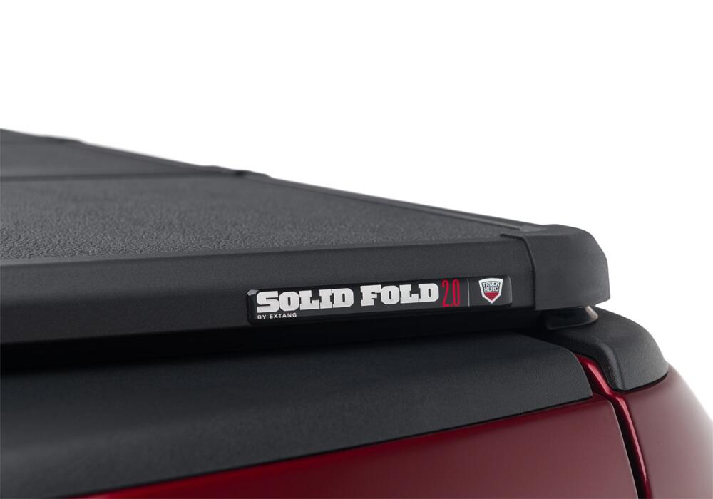 Solid Fold 2.0 Tonneau Cover Black Textured Paint 2019-2025 (New Body Style) Ram 5' 7 inch Bed with RamBox with or without Multifunction Tailgate Extang