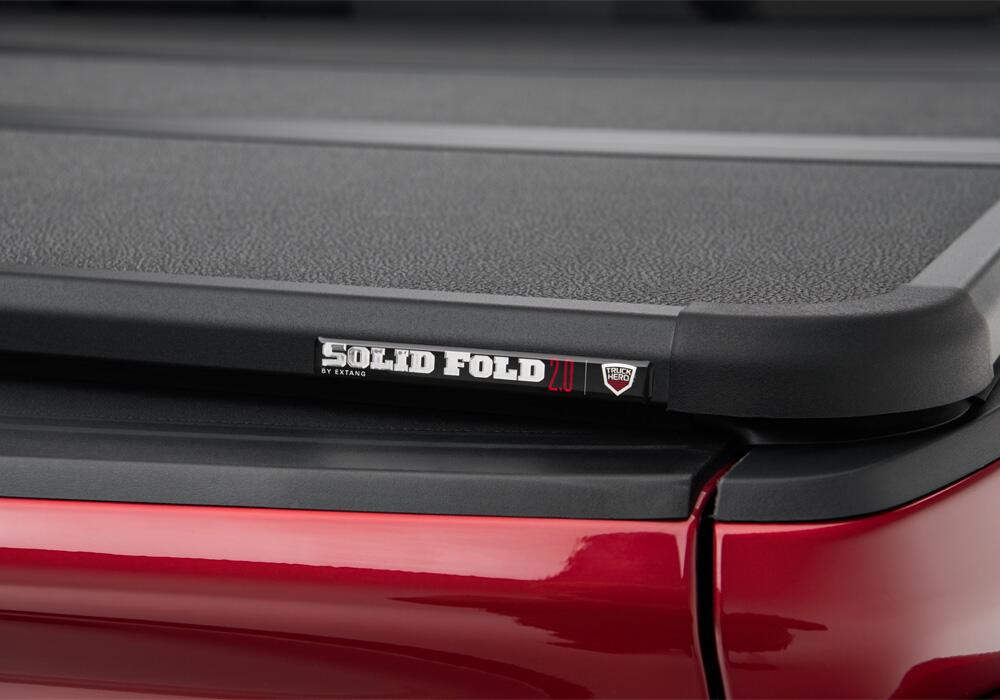 Solid Fold 2.0 Tonneau Cover Black Textured Paint 2020-2025 Silverado/Sierra 2500 HD/3500 HD 6' 9 inch Bed without Factory Side Storage Boxes Extang