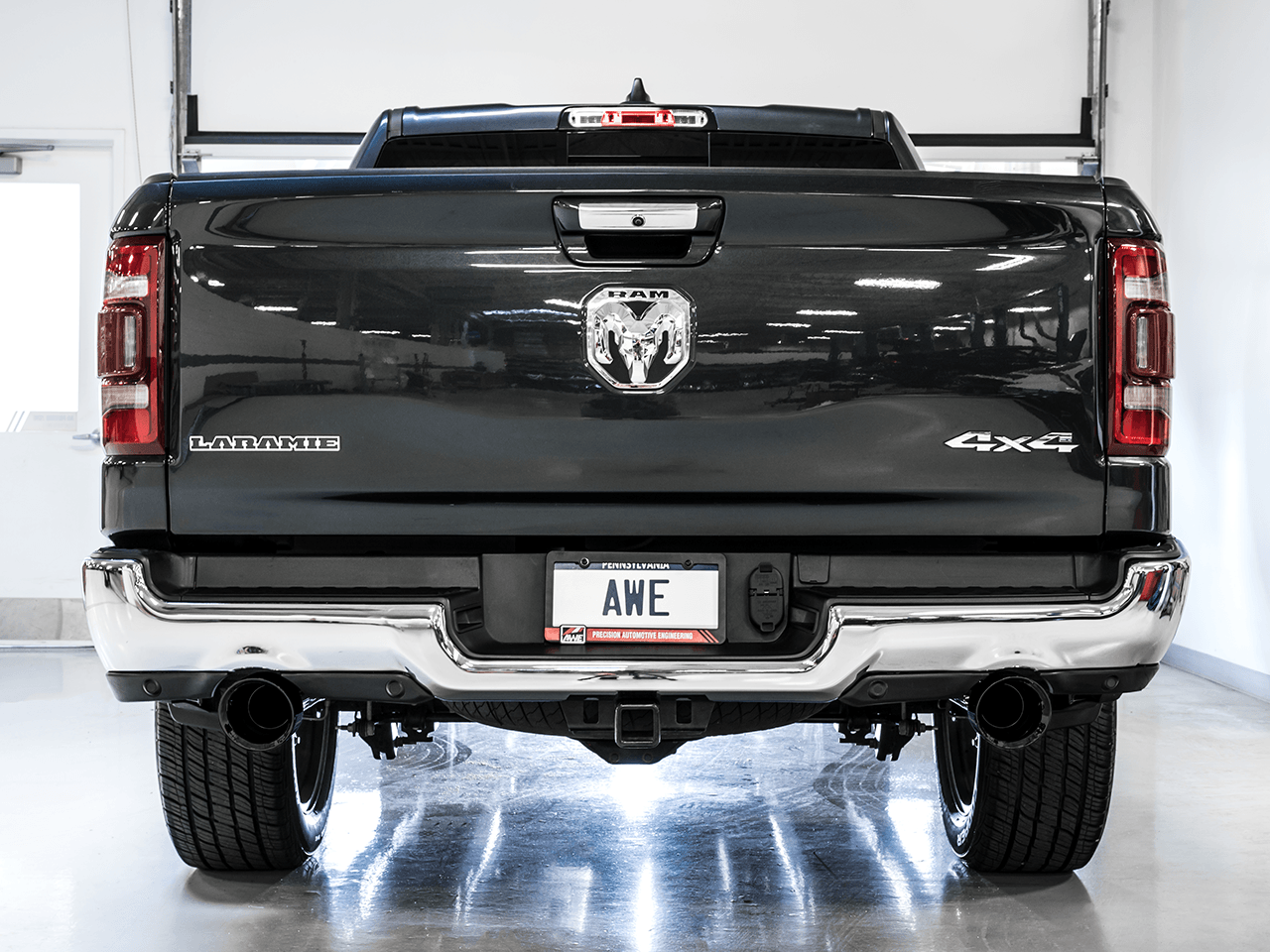 AWE 0FG Dual Rear Exit Catback Exhaust for 5th Gen RAM 1500 5.7L (with bumper cutouts) - Diamond Black Tips - Apollo Off-Road
